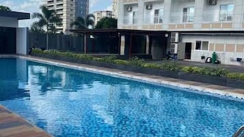 Outdoor pool, open 8:00 AM to 8:00 PM, pool umbrellas