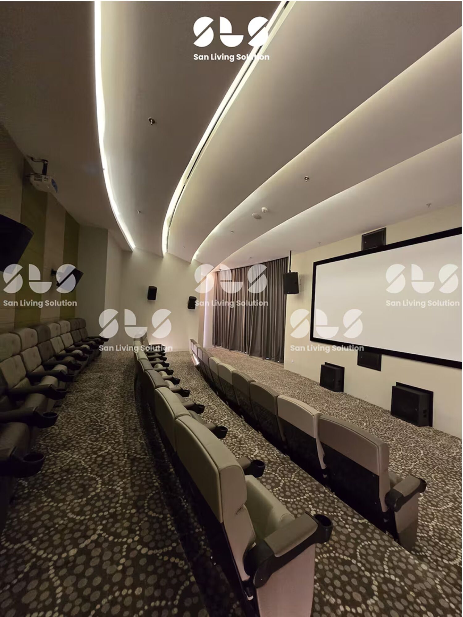 A conference room with a long table and chairs, a large screen, and a carpeted floor.