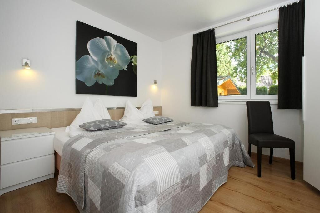 Deluxe Apartment, Patio, Garden View | In-room safe, laptop workspace, soundproofing, iron/ironing board