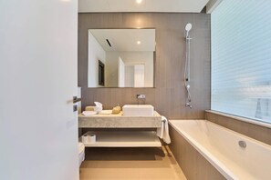 Shower, hair dryer, towels, shampoo