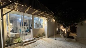 A covered outdoor area with a seating arrangement and a hammock. - A refuge for two between orchard and sea in Valencia, located in P.N.de lálbufera (Valencia)