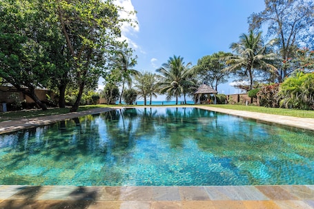 On the beach, white sand. Cocokinondo Villa & Boutique Hotel