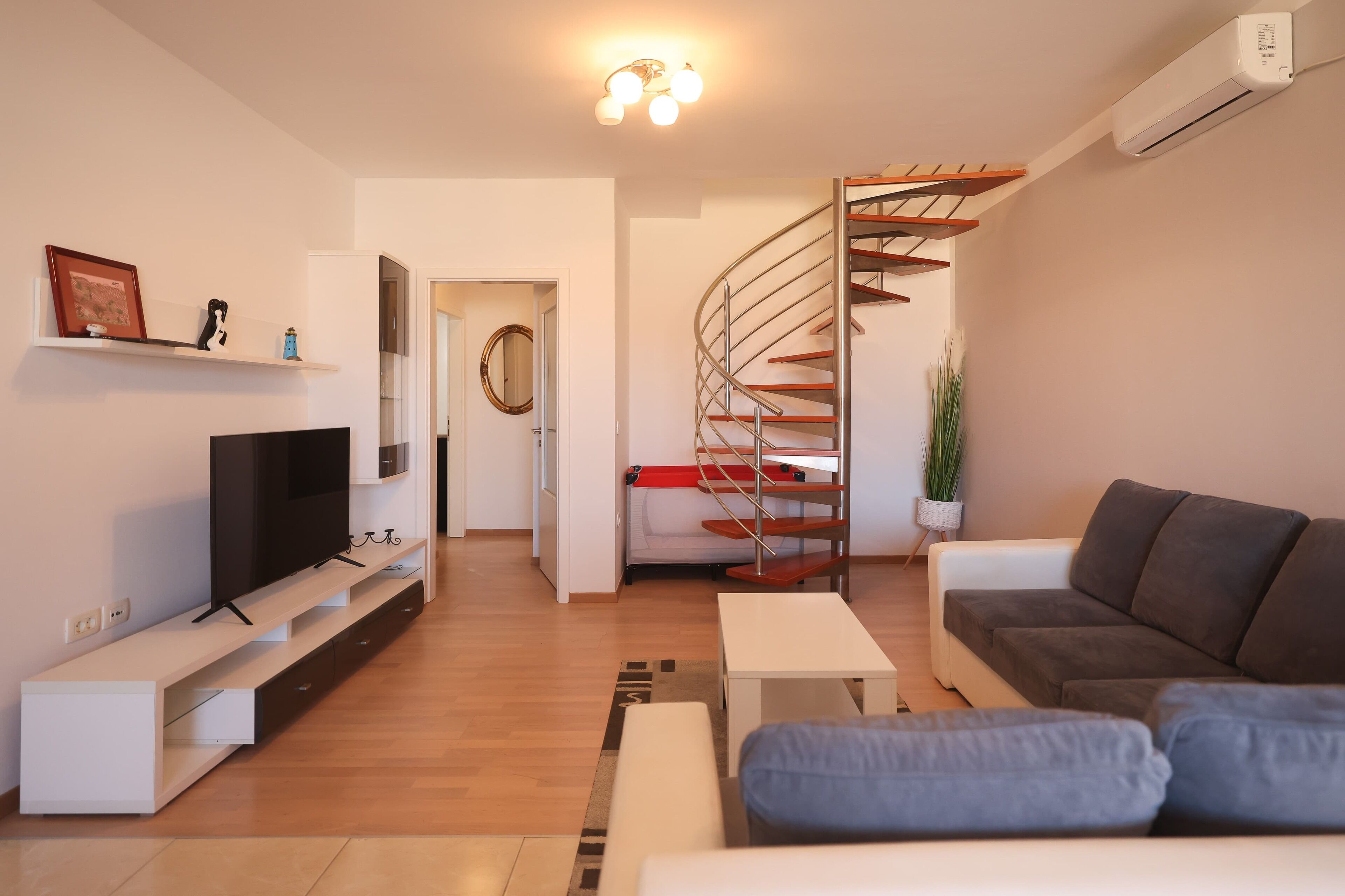 Comfort Apartment, Partial Sea View | Living area | 100-cm Smart TV with satellite channels