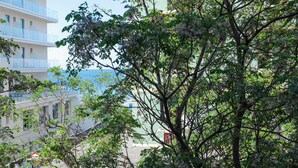 A modern building with multiple balconies overlooking a body of water. - SEA FRONT Gorgeous newly renovated beachfront apartment (Pesaro)