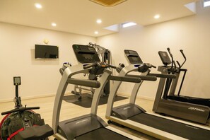 A gym with treadmills, elliptical machines, and a stationary bike. - 4BR Huge Pool Gym Pool Table V299 (Choeng Thale)