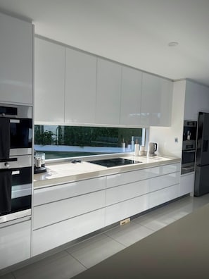 Private kitchen - Waterfront retreat with jetty, pool, waterslide and luxury comfort. (Mermaid Waters)