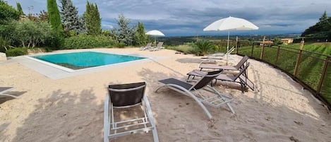 Seasonal outdoor pool, pool umbrellas, sun loungers