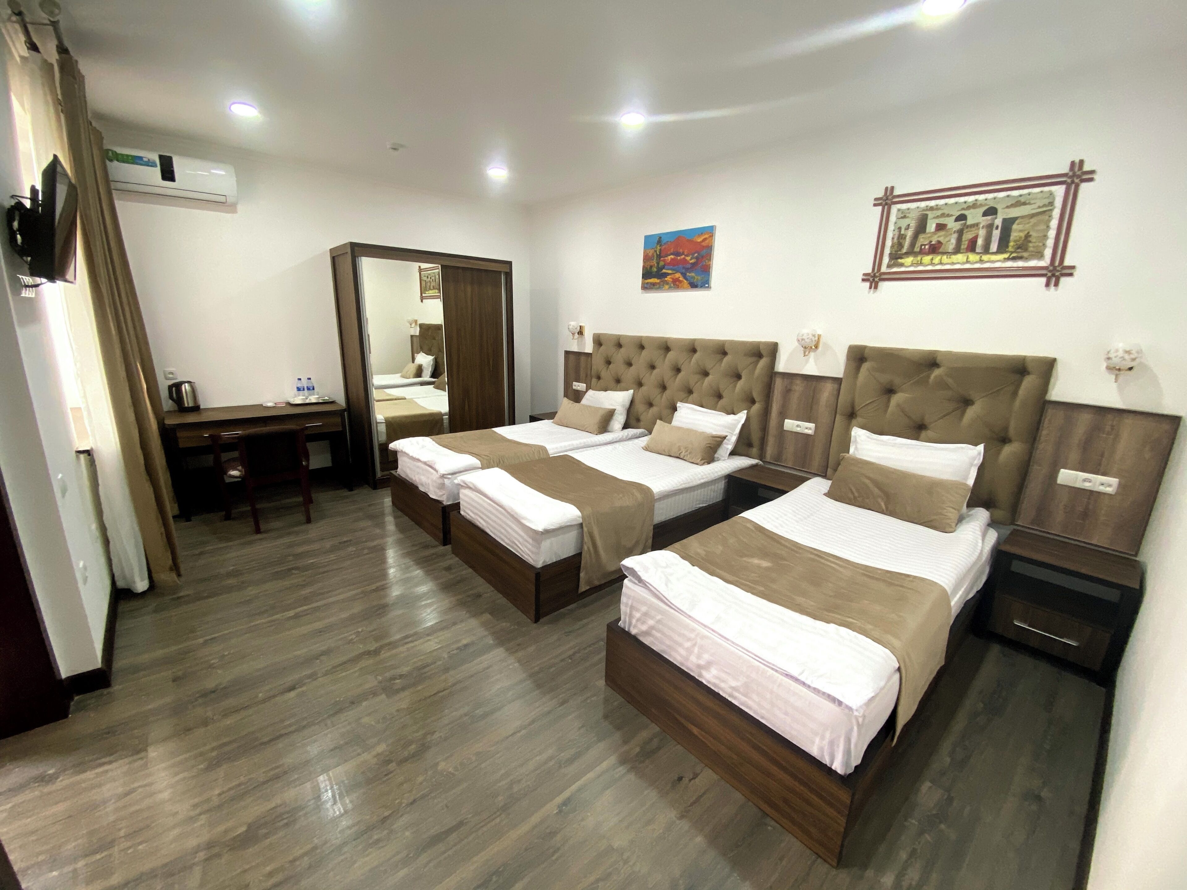 Standard Triple Room, Garden View | Desk, laptop workspace, WiFi (free), bed sheets