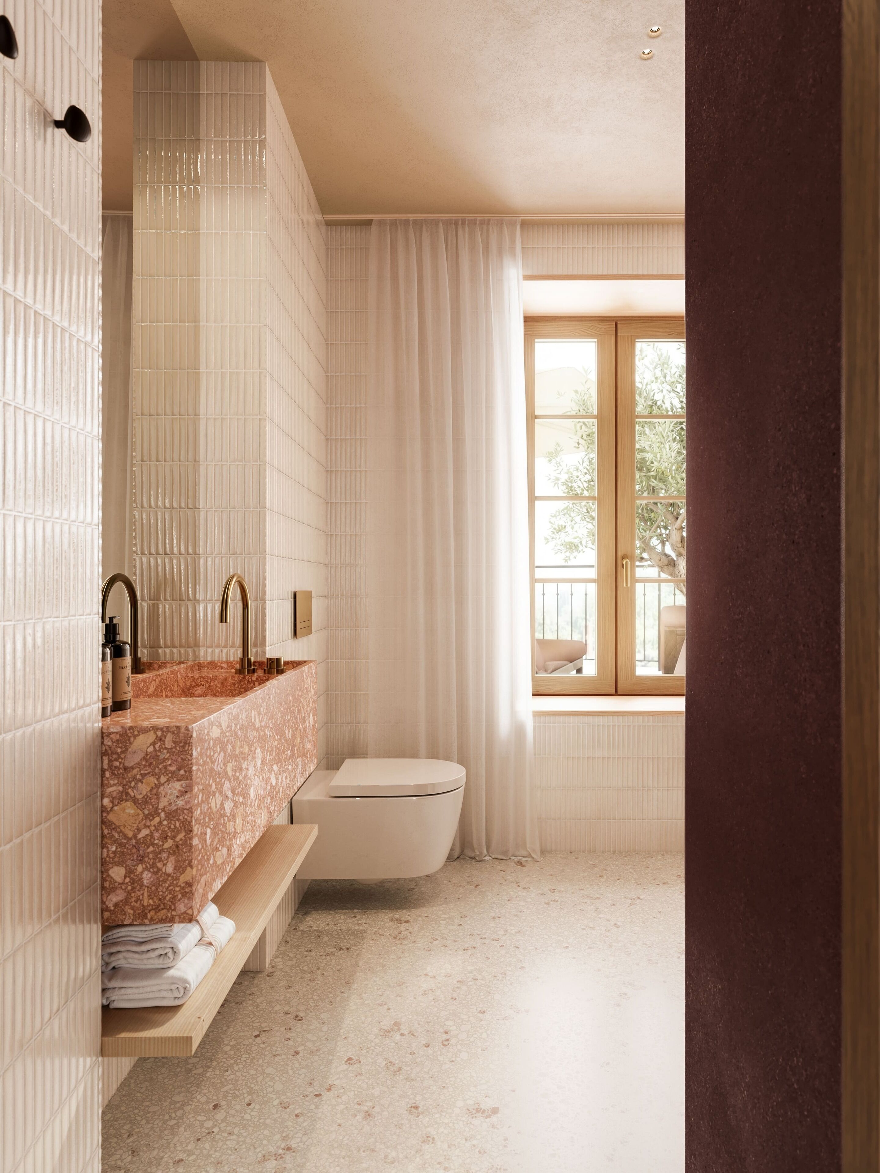 A bathroom with a marble sink, a toilet, and a window with curtains.
