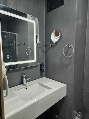 Shower, eco-friendly toiletries, hair dryer, towels