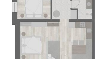 Plano de un cuarto de hotel con televisión, zona de estar, kitchenette y baño.