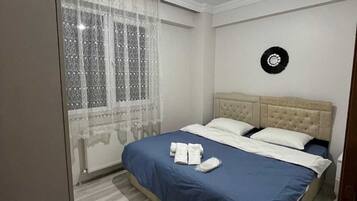 Deluxe Condo, Balcony, City View | Desk, laptop workspace, free WiFi