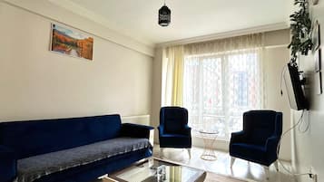 Deluxe Condo, Balcony, City View | Living area