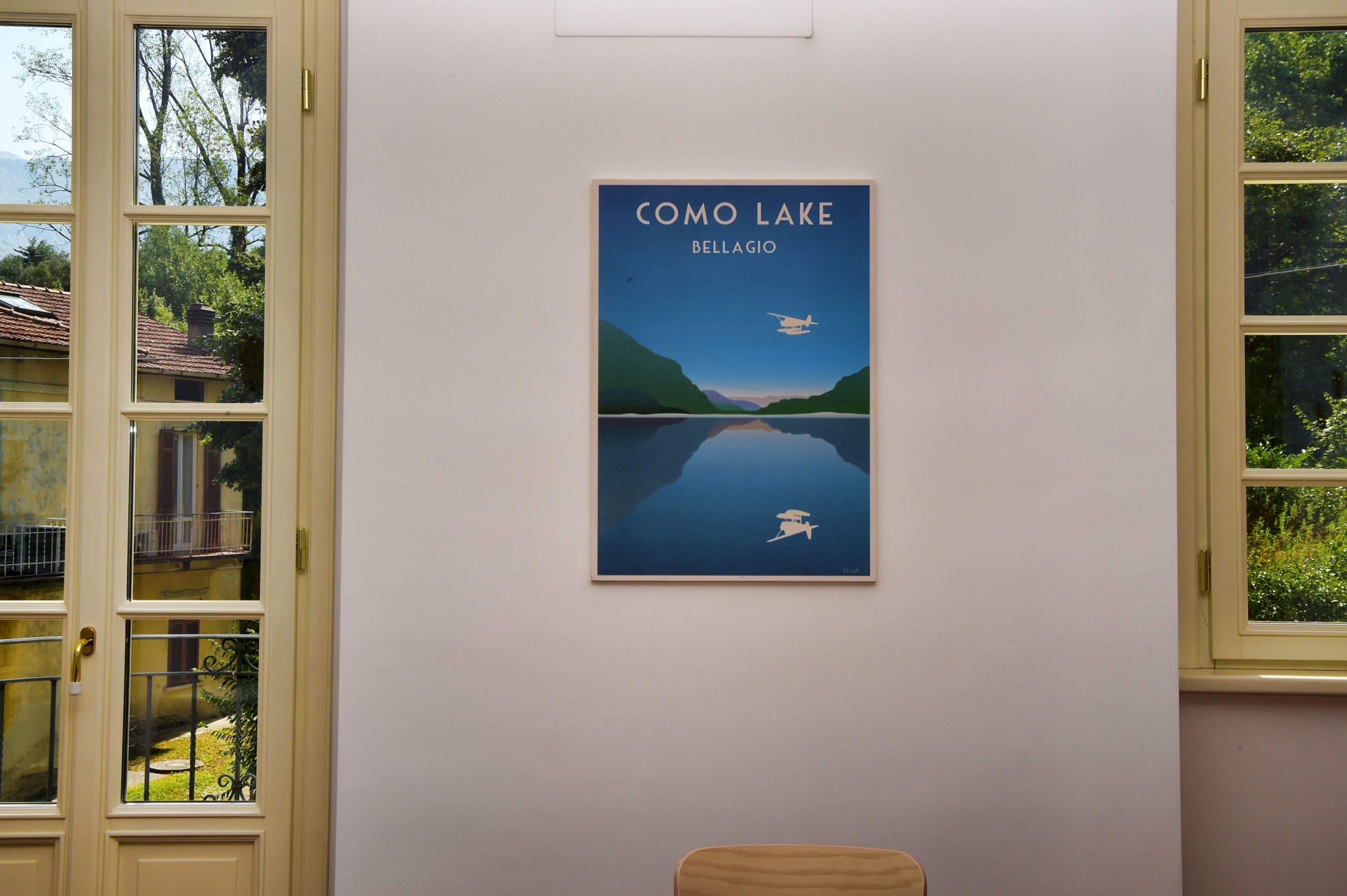 A framed artwork titled "Como Lake Bellagio" on a wall.