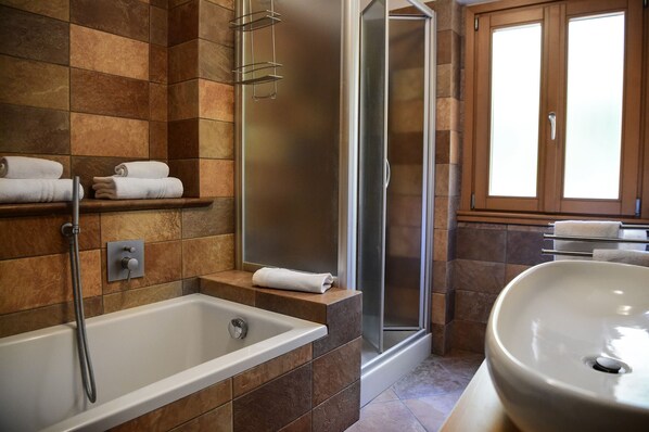 Shower, jetted tub, hair dryer, bidet