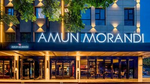 A hotel entrance with a large illuminated sign reading 'AMUN MORANDI'. - Giorgio Morandi Hotel - Xuyi Kejie Central Mall  (Huai'an)