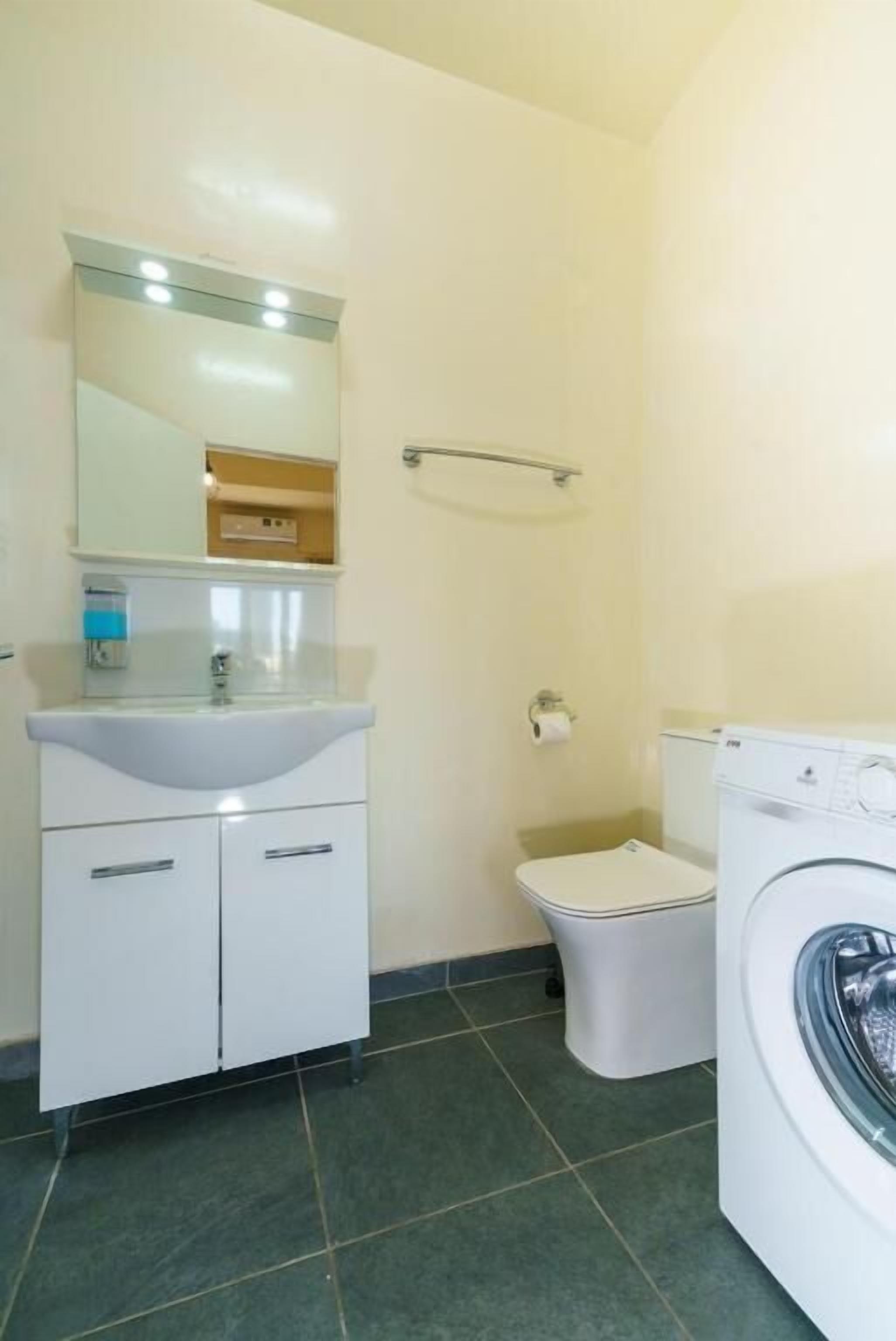 Apartment, Balcony, City View | Bathroom | Free toiletries, hair dryer, slippers, towels