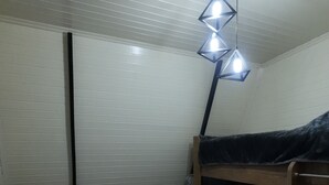 A small, compact room with two bunk beds, a bedside table, a lamp, and a window with blinds. - Cozy A-Frame house in Gabala.
Nature retreat with mountain view and Heated pool (Gebele)