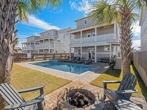A two-story building with a swimming pool, outdoor seating, and a fire pit. - Costal Style 3-story W 7BR and Near the Beach (Miramar Beach)