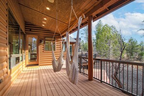 A wooden log cabin with a deck, large windows, and a hanging hammock. - Forest-view Gem, 4 Mi to Fool Hollow Lake! (Show Low)