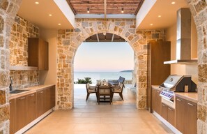Outdoor dining - Elegant Waterfront Villa with Uninterrupted Ionian Views and Direct Sea Access (Meganissi)
