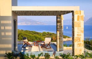 Outdoor dining - Elegant Contemporary Villa with Mesmerising Ionian Views and Sea Access (Meganissi)