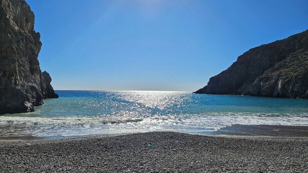 A coastal beach with rocky cliffs and clear blue sea. - EL-LU 2 Villa with breathtaking 360-degree seaview and a private pool (Kamilari)