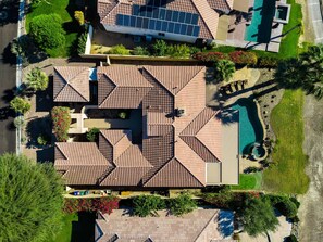 A residential property with a complex roof structure, a swimming pool, and surrounding greenery. - 4 Bedroom Private Pool Home in Mira Vista (Rancho Mirage)