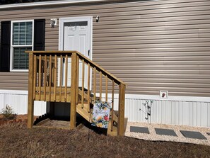 Exterior detail - Centrally located 2026 cottage style mobile home on private  property (Jacksonville)