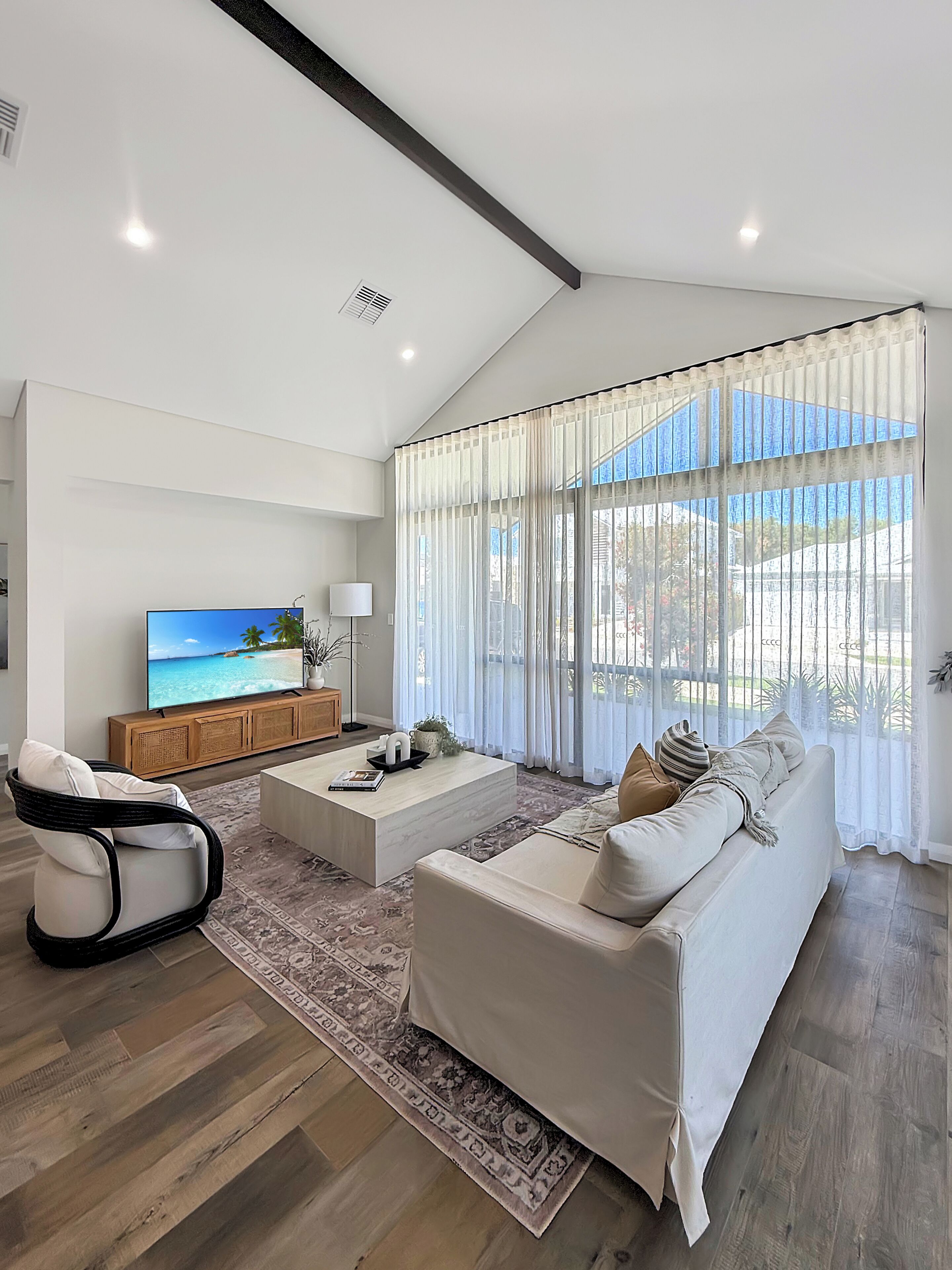 This living area with a bright and welcoming living space designed for comfort, relaxation, and quality time together.