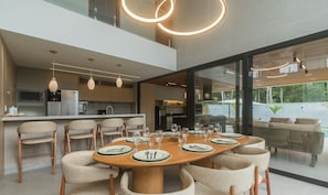 A modern kitchen with a dining area.