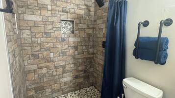 Shower, hair dryer, towels, toilet paper