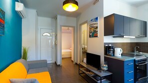 A modern apartment with a living area, kitchenette, and a bedroom. - Casa D'arte - Corfu Town (Kerkira)