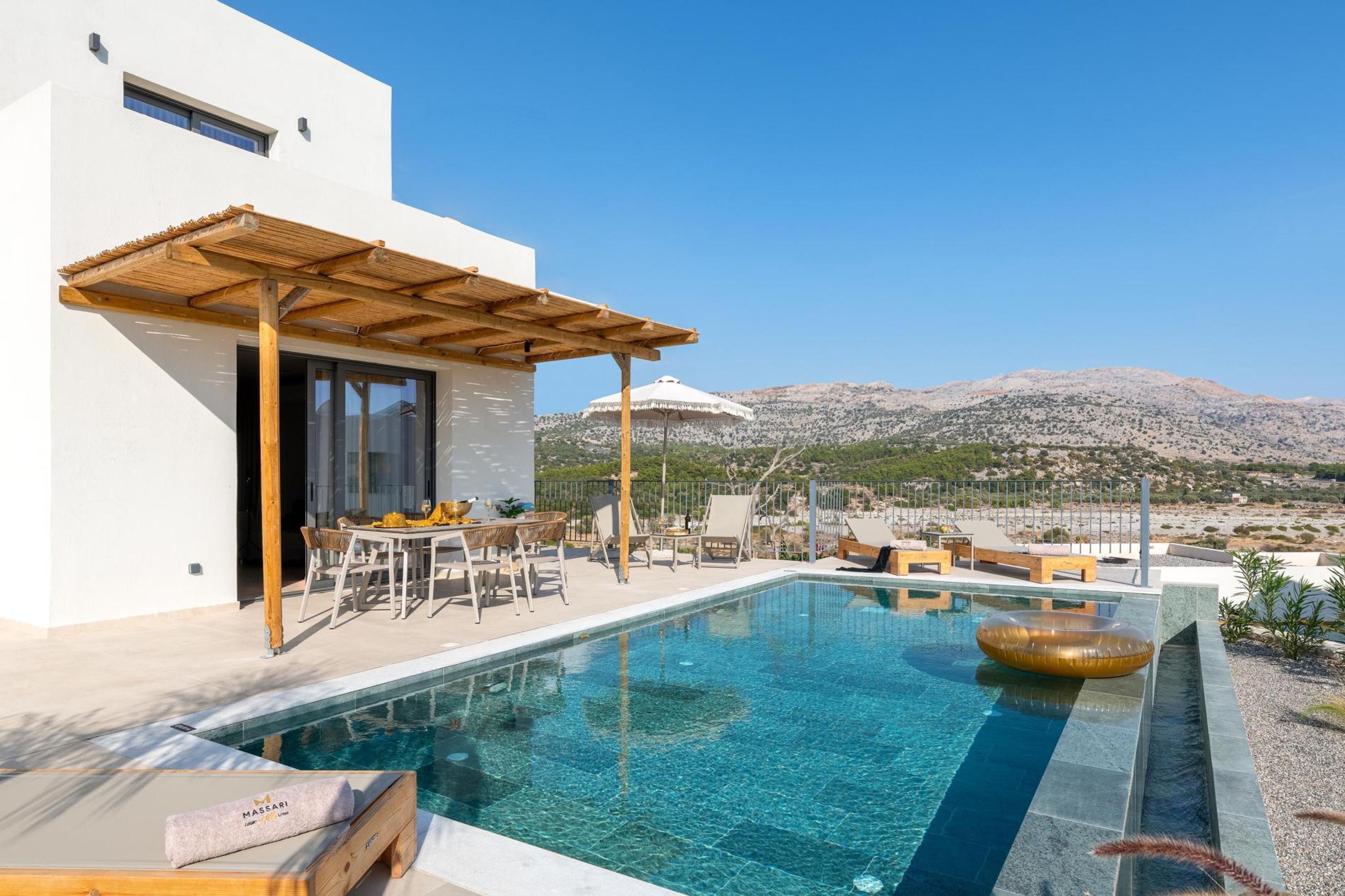 A modern pool area with a clear view of the surrounding landscape.