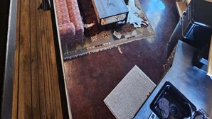 A spacious loft with a curved staircase, a cozy seating area with patterned cushions, and a dining table with a rustic rug. - The Silo On 16 (Graham)