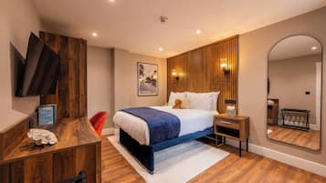 Apartament Deluxe | Caixa forta a l'habitació i escriptori