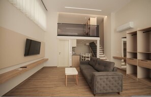 A modern living room with a grey sofa, a small white table, and a TV mounted on the wall. - Duplex City 08 in Durrës (Durrës)