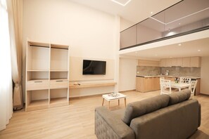 A modern apartment with a living room, a dining area, a kitchen, and a balcony. - Duplex City 03 in Durrës (Durrës)