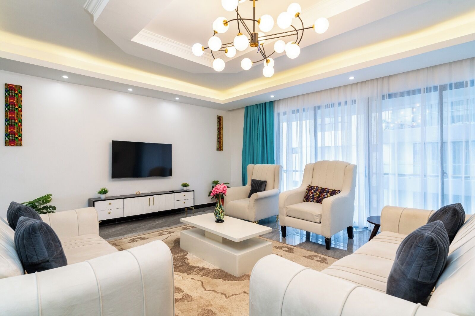 Family Apartment, City View | Living area | 32-inch Smart TV with digital channels