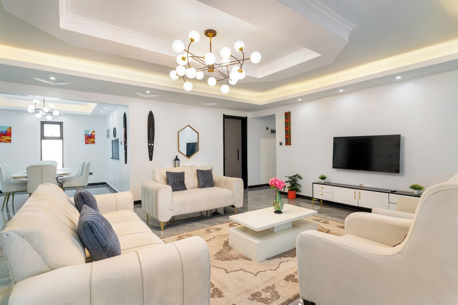 Family Apartment, City View | Living area | 32-inch Smart TV with digital channels