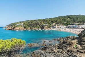 A coastal town with clear blue waters, rocky shores, and buildings on a hillside. - Irina - Four Bedroom Villa, Sleeps 8 (Costa Brava)