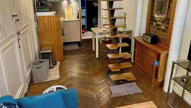 A compact, multi-level room with a bunk bed, a spiral staircase, and a kitchenette. - STUDIO NOTRE DAME - Latin Quarter (Paris)