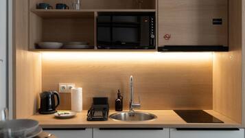 Fridge, microwave, stovetop, cookware/dishes/utensils