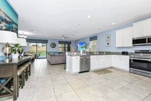 Fridge, microwave, oven, stovetop - ChampionsGate 9BR Villa Pool Jacuzzi Oasis Disney (Four Corners)