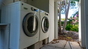 A laundry facility with two front-loading washing machines. - Cindy Villa - Key Largo (Key Largo)