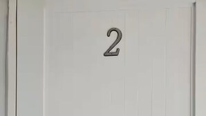 A white door with the number 2 on it. - Unit 2@Casa Catalina-City, Culture, & Coastline (San Juan)