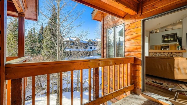 A wooden cabin with a balcony overlooking a snowy landscape. - New Listing! Ski In/Walk to the Lift (Breckenridge)