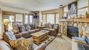 A cozy living room with two sofas, a coffee table, and a fireplace. - New Listing! Ski In/Walk to the Lift/Town (Breckenridge)