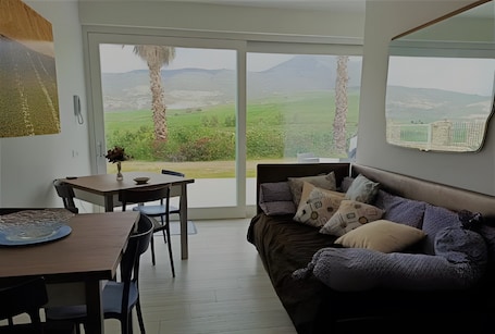 TV. Villa Degli Alberi with Garden, Private Terrace, Wi-Fi and Air Conditioning
