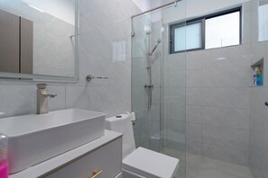 Deluxe Apartment, Balcony, City View | Bathroom | Slippers, towels, soap, toilet paper - Royal Oaks Residency (Nairobi)